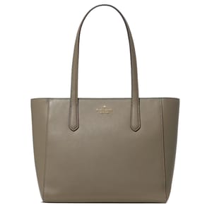A taupe Kate Spade New York tote bag with dual handles and a saffiano leather finish.