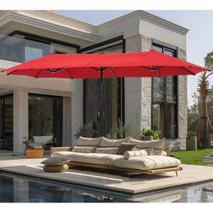 A large red patio umbrella with a sectional outdoor sofa by a swimming pool.