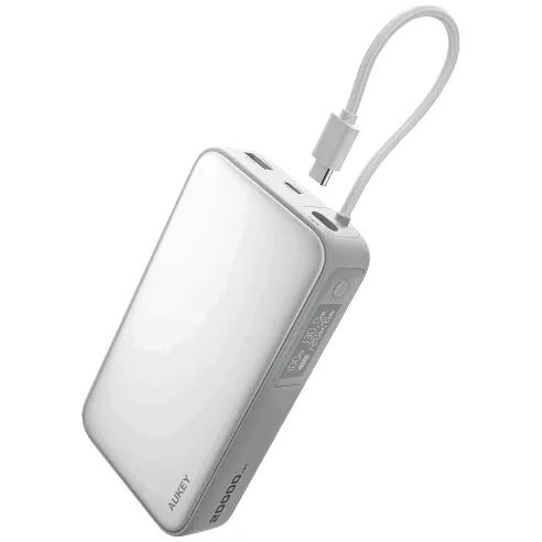 A white AUKEY power bank with a built-in cable, featuring multiple ports and a 20,000mAh capacity.