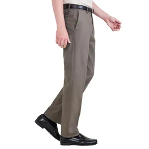 A person is wearing brown dress pants with a black belt and black dress shoes. The pants have a straight fit, and the shoes are polished and formal.