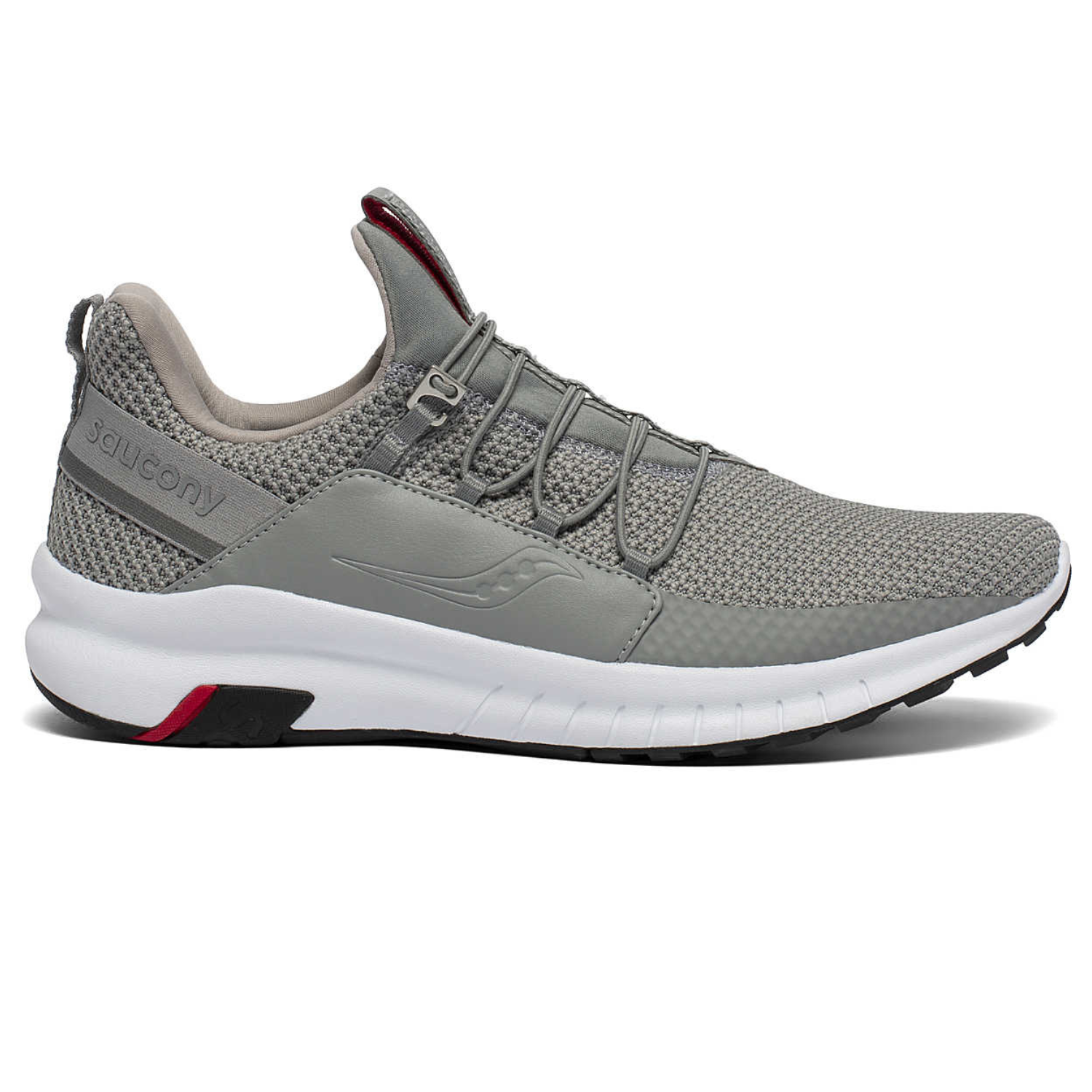 Gray athletic sneaker with a knit upper, slip-on design, elastic laces, and a white sole with black and red accents, featuring Saucony branding on the side and heel.