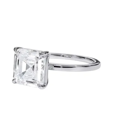 A ring featuring a square-cut diamond set in a simple, elegant metal band.