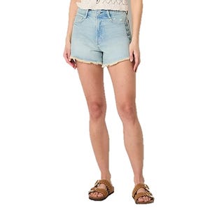 Light blue denim shorts with a frayed hem, paired with a crocheted top and tan sandals.
