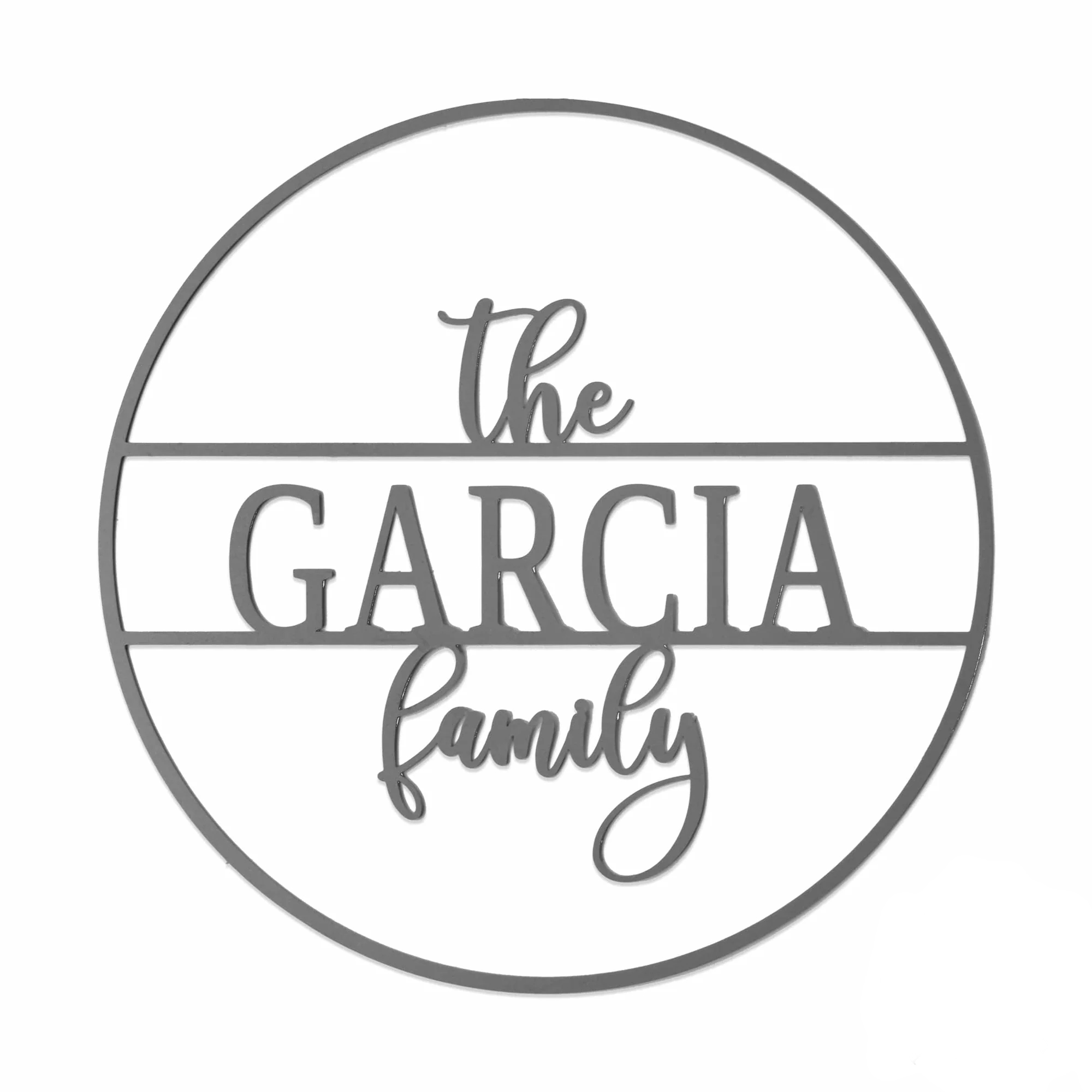Circular metal sign reading \“The Garcia Family\“ with \“Garcia\“ in bold and \“The\“ and \“family\“ in cursive.