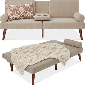 A beige upholstered futon with cylindrical armrests and tapered wooden legs, accompanied by a matching ottoman with a knit throw and cylindrical cushion.