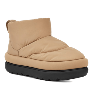 UGG Maxi Mini Boots in beige feature a puffy, quilted design with a high cushioned ankle and a thick black sole, offering a cozy and modern look.