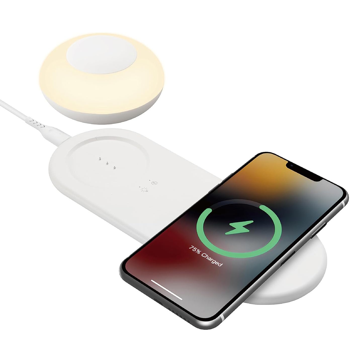 Wireless charging pad with a smartphone displaying 76% charge, alongside a small round night lamp.