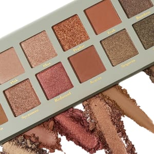 Eyeshadow palette showcasing various shimmer and matte shades named after types of wood such as Oak, Elm, and Redwood.