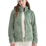 A woman is wearing a light green fleece jacket with a white beanie and shirt, paired with light-colored pants.