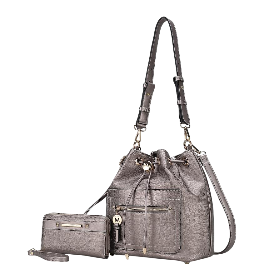 A grey leather bucket bag with adjustable straps and front pocket, accompanied by a matching wristlet with a front zip pocket and decorative M charm.