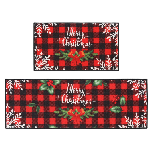 Two rectangular, red and black plaid mats featuring \“Merry Christmas\“ text, adorned with snowflakes and festive greenery accents.