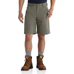 Olive green shorts and brown work boots worn with light grey socks.