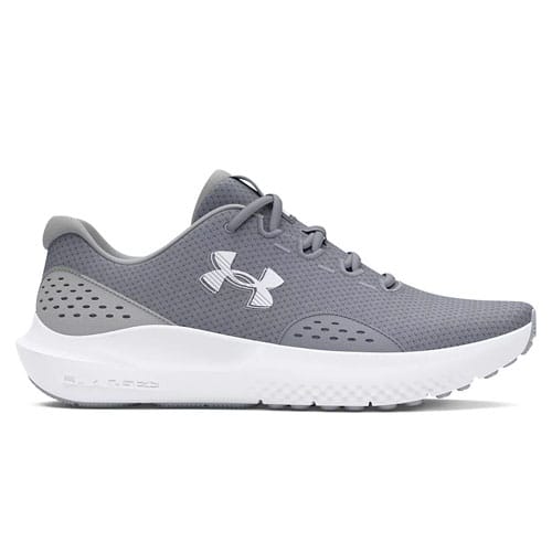 Gray athletic shoe with a perforated design, mesh upper, and a white cushioned sole, featuring the Under Armour logo.
