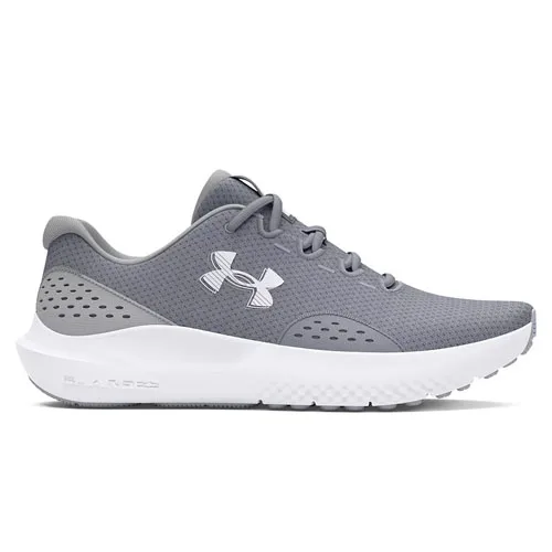 Gray athletic shoe with a perforated design, mesh upper, and a white cushioned sole, featuring the Under Armour logo.