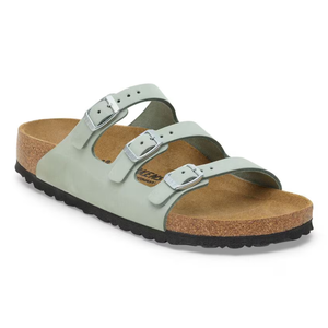 A light gray sandal featuring three adjustable straps with silver buckles and a cork footbed. The sole is black and contoured for comfort.