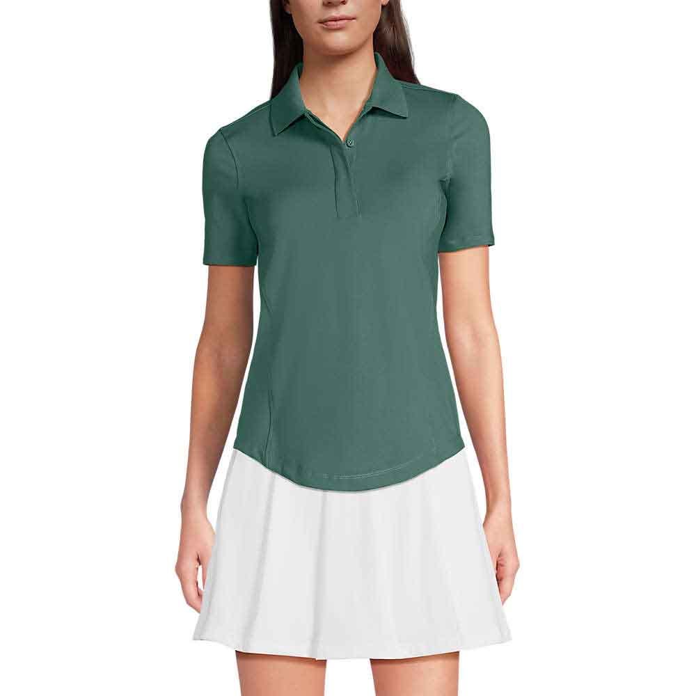 A woman in a green, short-sleeved Lands' End Women's High Impact Polo with a collar, paired with a white skirt.
