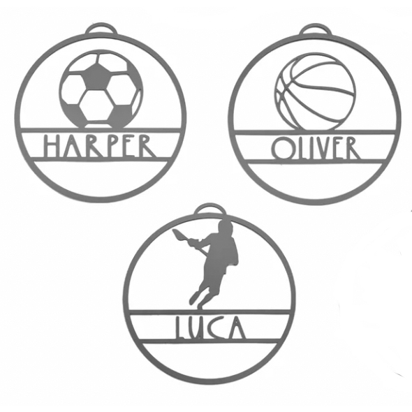 Three circular personalized sports-themed name tags with soccer, basketball, and baseball designs labeled \“HARPER,\“ \“OLIVER,\“ and \“LUCA.\“