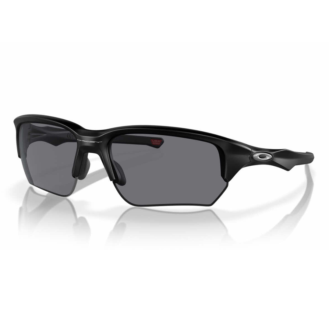 Black sports sunglasses with a sleek, half-rim design and dark lenses, featuring the Oakley logo on the temple.