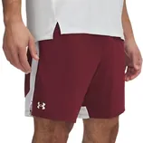 A man wearing maroon Under Armour shorts with a white side stripe and a white top.