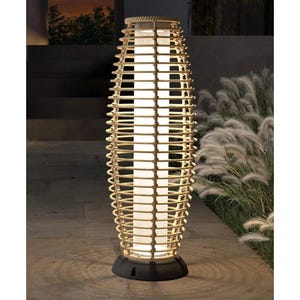 A tall, cylindrical outdoor floor lamp with a lighted interior and a wooden lattice design.