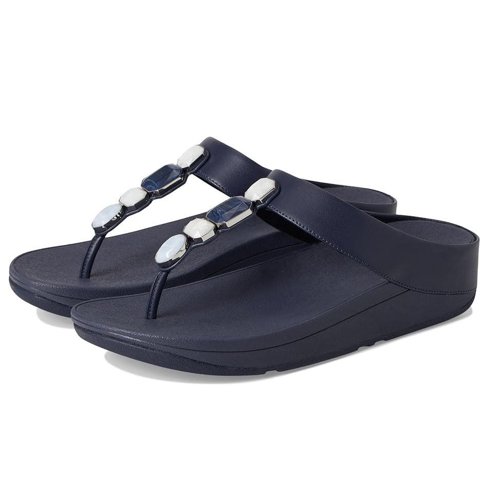 Navy blue thong sandals with gemstone embellishments along the straps, featuring a platform sole for added height and comfort.
