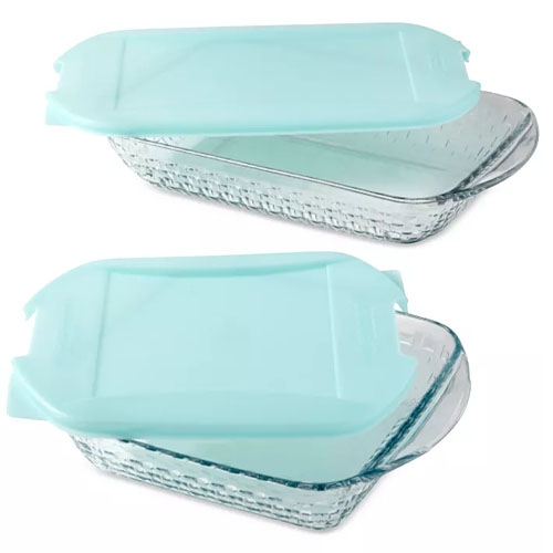 2 rectangular glass baking dishes with textured sides, each featuring a teal plastic lid designed for secure coverage and easy storage.