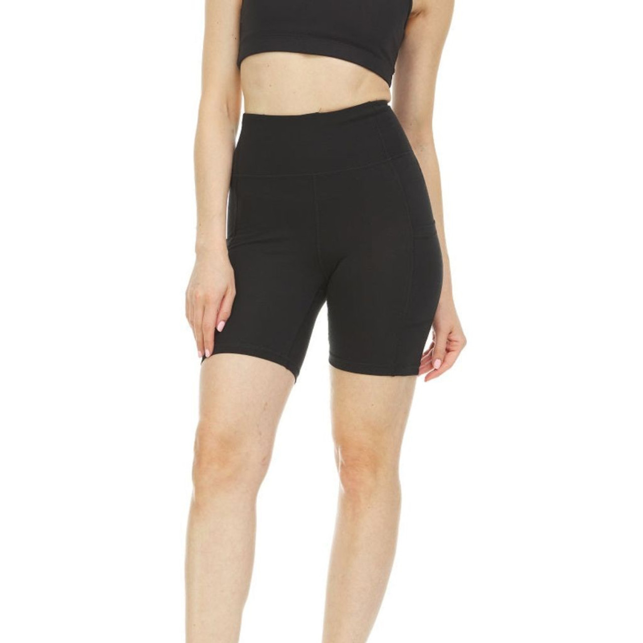 High-waisted black yoga biker shorts with a form-fitting design and a wide waistband, reaching mid-thigh in length.