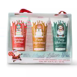 Hand Lotion Trio set featuring three 1.35 fl oz scented lotions: Gumdrop Buttons, Fresh Gingerbread, and Frosty White Snow. Each tube is decorated with festive snowman designs and comes in a clear package with a red ribbon. Total net weight: 4.06 fl oz / 120 ml.