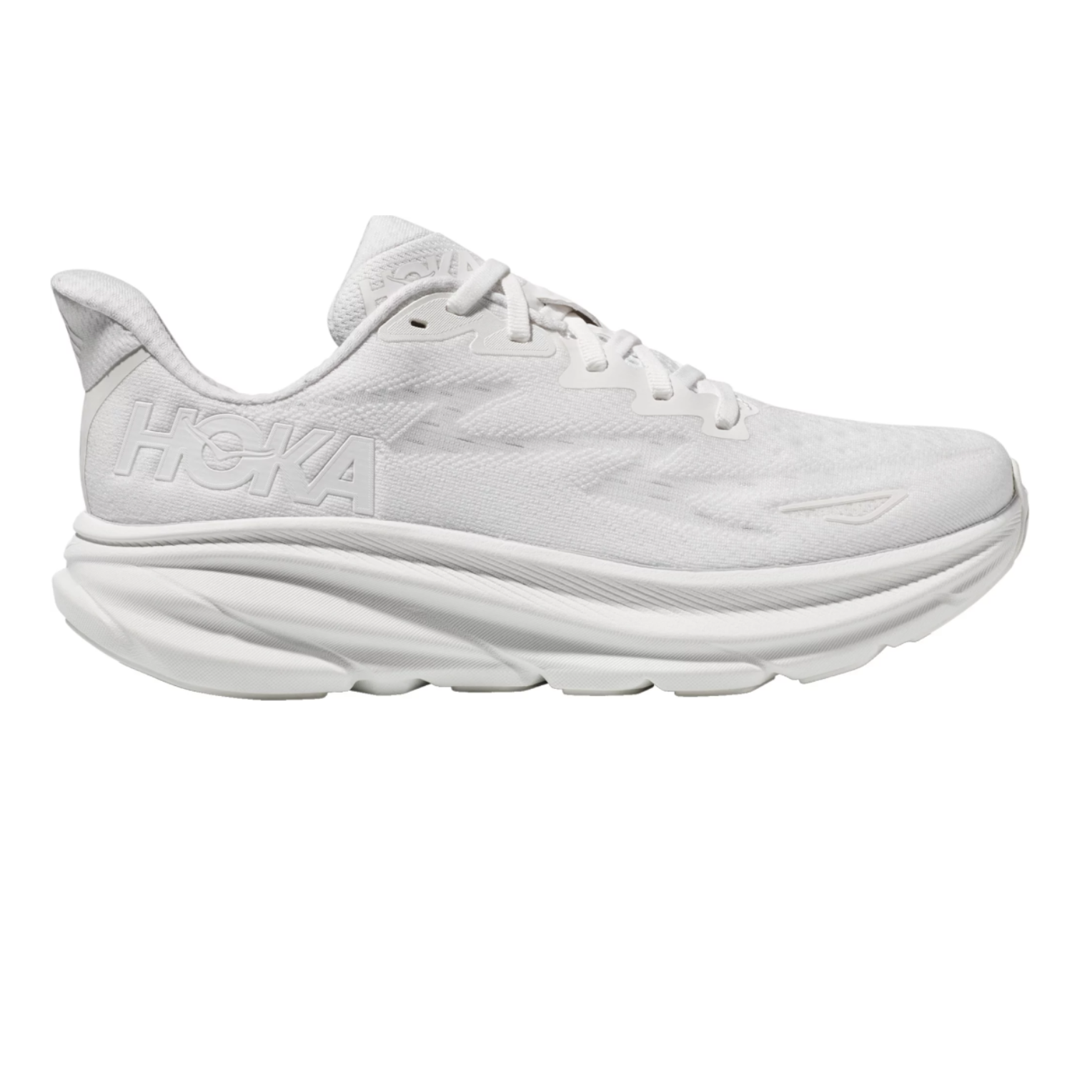 Hoka Women's Clifton 9 Shoes are all-white running shoes featuring a cushioned sole for comfort and support, with \“HOKA\“ branding on the side.