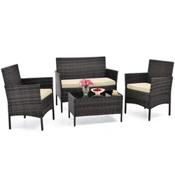 4-piece rattan patio set includes two armchairs, a loveseat, and a glass-top coffee table, all with beige cushions.