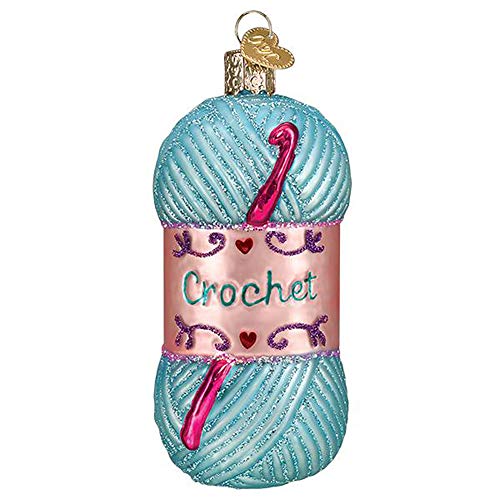 Ornament shaped like a skein of yarn with crochet hooks and \“Crochet\“ written on the label. Features a glittery blue and pink design.