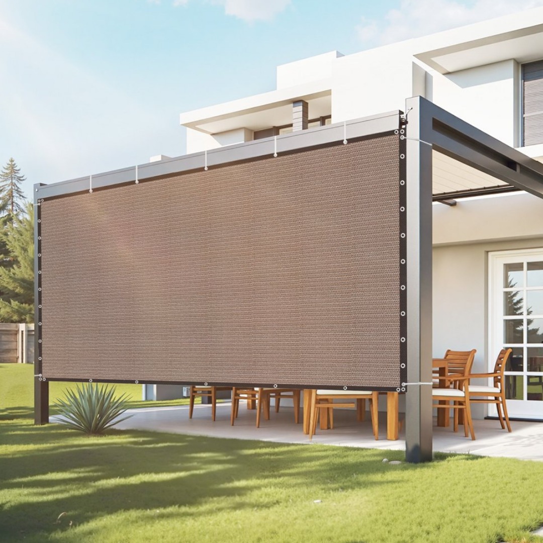 A modern outdoor pergola with a retractable privacy screen or shade, featuring a metal frame and wooden dining set underneath, situated by a contemporary house.