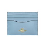 Light blue Coach cardholder with gold logo and multiple card slots.