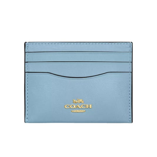 Light blue Coach cardholder with gold logo and multiple card slots.
