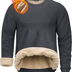 A dark gray fleece-lined sweatshirt with beige sherpa lining, featuring a flaming basketball graphic in the corner.