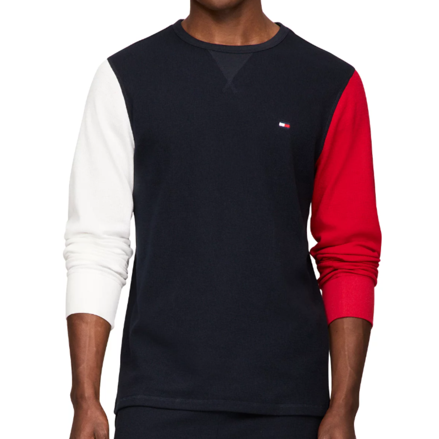 A thermal shirt with a navy blue torso, white left sleeve, and red right sleeve, featuring a small logo on the chest.