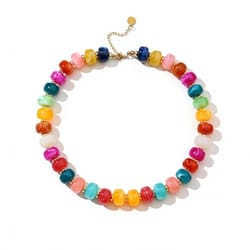 A necklace featuring colorful, rounded beads in a gradient of shades, with an adjustable gold chain clasp.