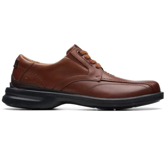 Brown leather lace-up shoe with black sole, featuring detailed stitching and a cushioned heel.