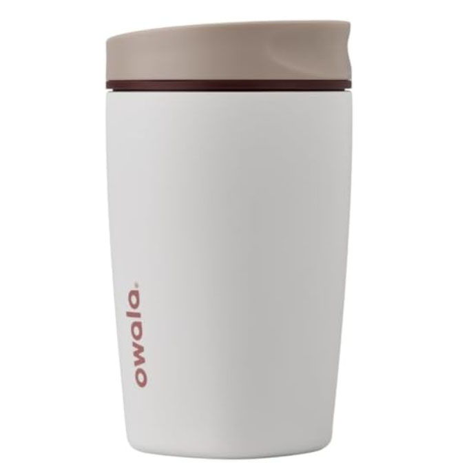 A white reusable tumbler with a beige lid and the brand name \“owala\“ printed in red on the side.