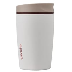 A white reusable tumbler with a beige lid and the brand name \“owala\“ printed in red on the side.