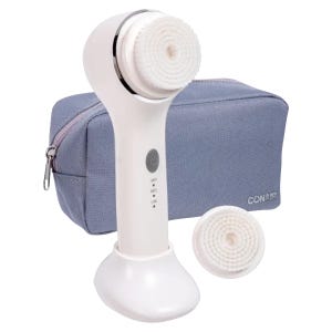 The Conair Sonic Facial Brush Kit includes a white handheld sonic facial brush with a detachable brush head, an additional brush head, and a gray zippered travel pouch.