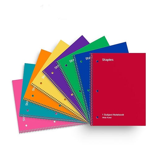 eight stapes one subject notebooks fanned out in a variety of colors