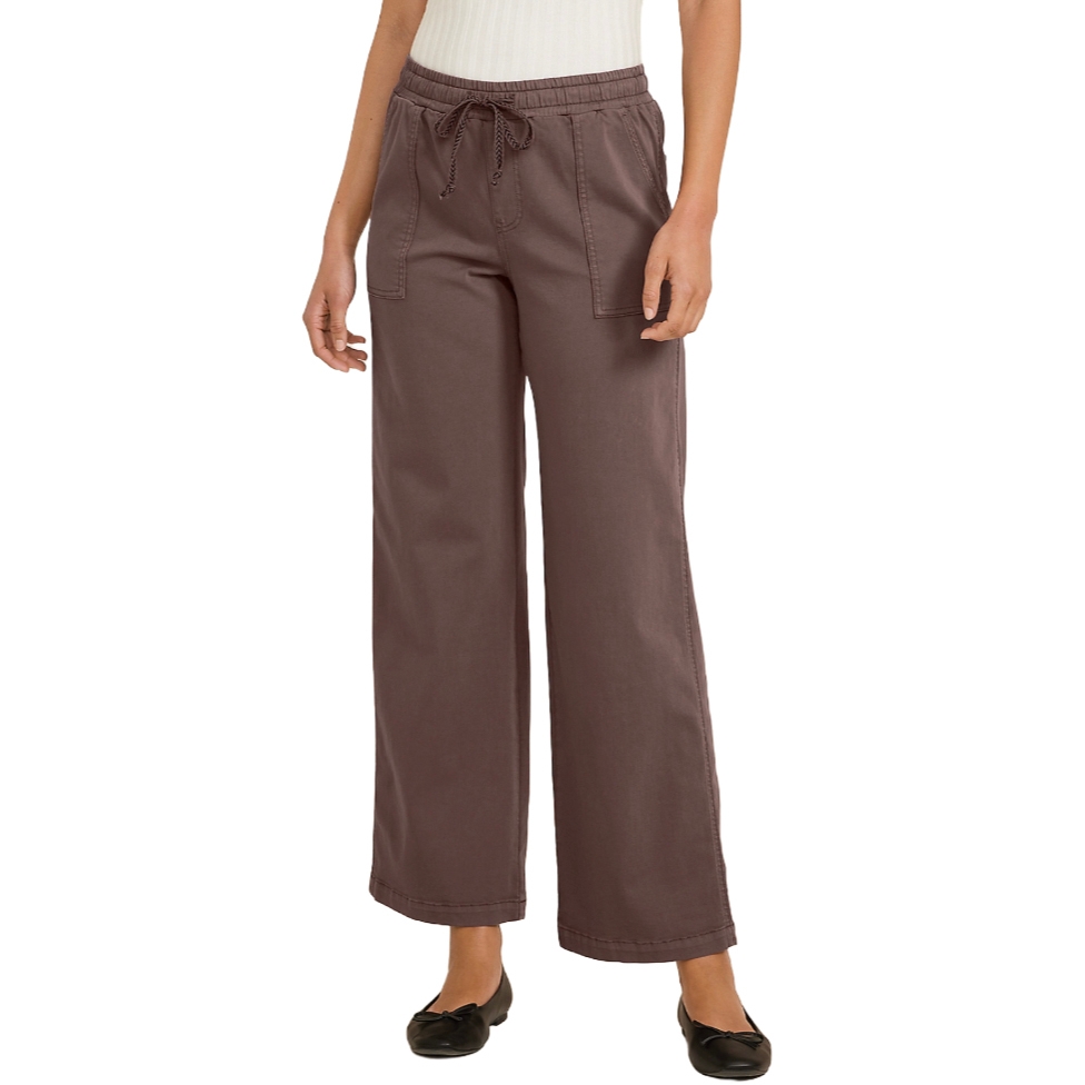 Wide-leg brown drawstring pants paired with a white ribbed top and black ballet flats.