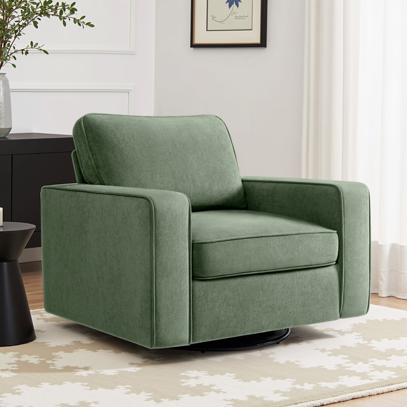A green swivel accent chair with a modern, boxy design, set on a black base.