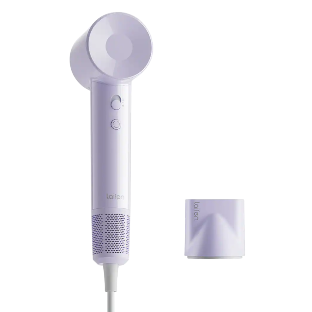 A lavender-colored hair dryer with a minimalist design and matching nozzle attachment is shown.