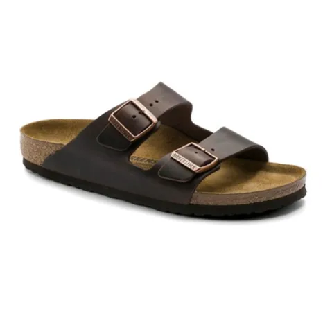 A brown sandal with two adjustable straps and a cork footbed design, typically associated with comfort and casual wear.