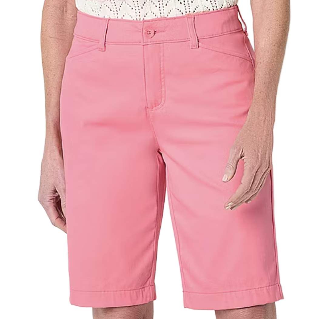 A pair of pink knee-length shorts with a button and zip closure, belt loops, and side pockets.