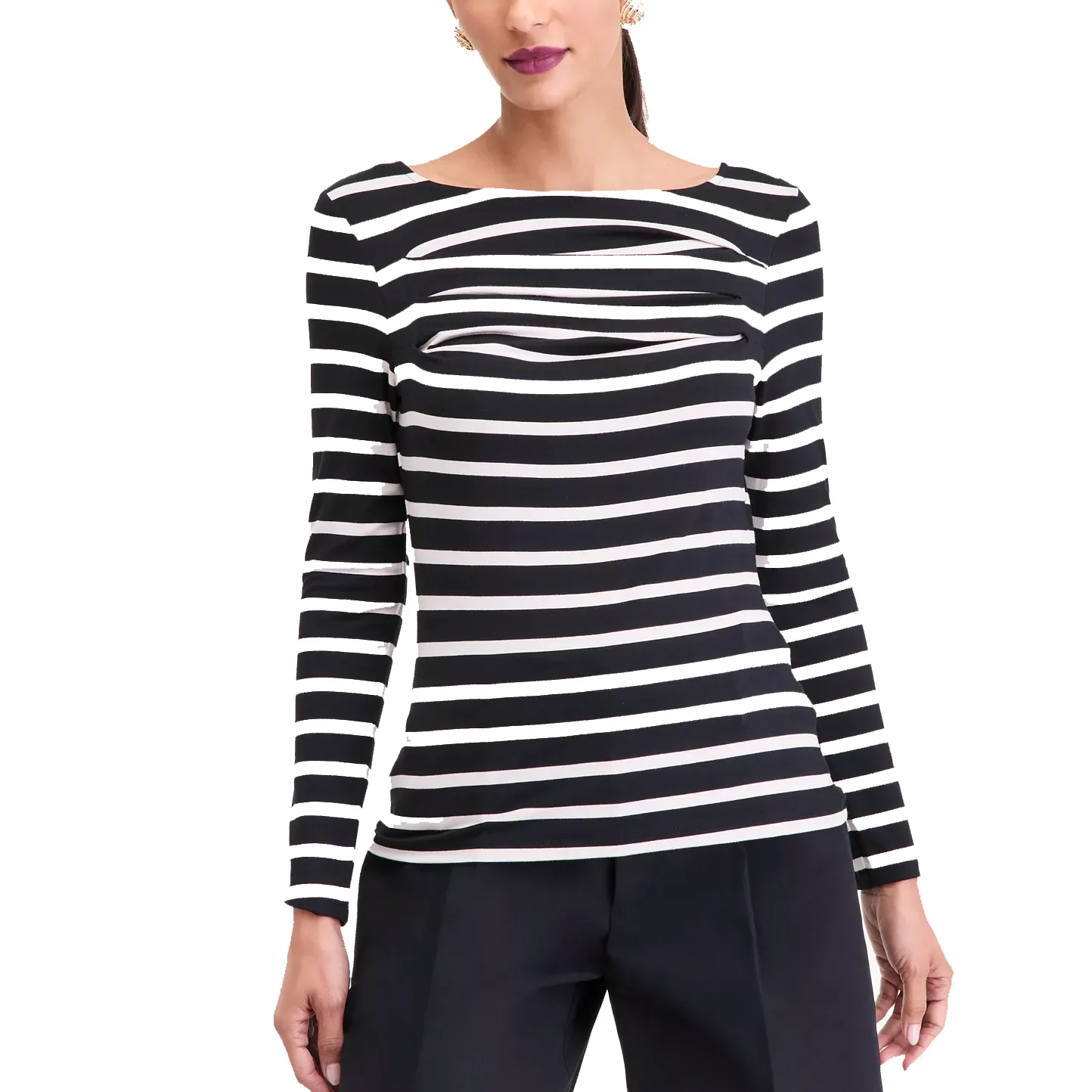 A woman wearing a black and white striped long-sleeve top with a boat neckline and slight ruching across the chest, paired with dark trousers.