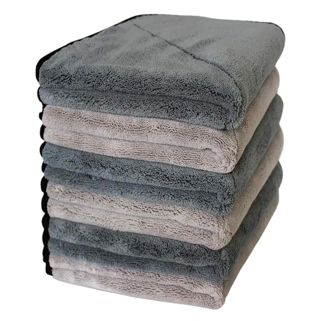 A stack of six microfiber drying towels in alternating light and dark gray shades, each measuring 16 inches. The towels have a plush texture and black edge trimming.