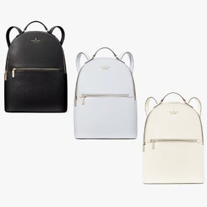 Three leather backpacks, in black, white, and off-white, with gold-tone zippers.
